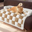 Golden retriever enjoying the Plush & Thickened Dog Mat in beige and white, adding comfort and style to a brown sofa.