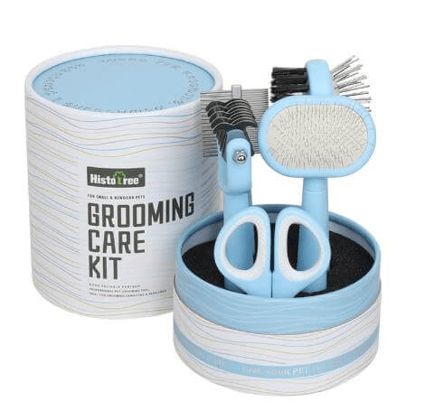 Premium Pet Grooming Kit with brushes, combs, and clippers for cats and dogs in elegant packaging.