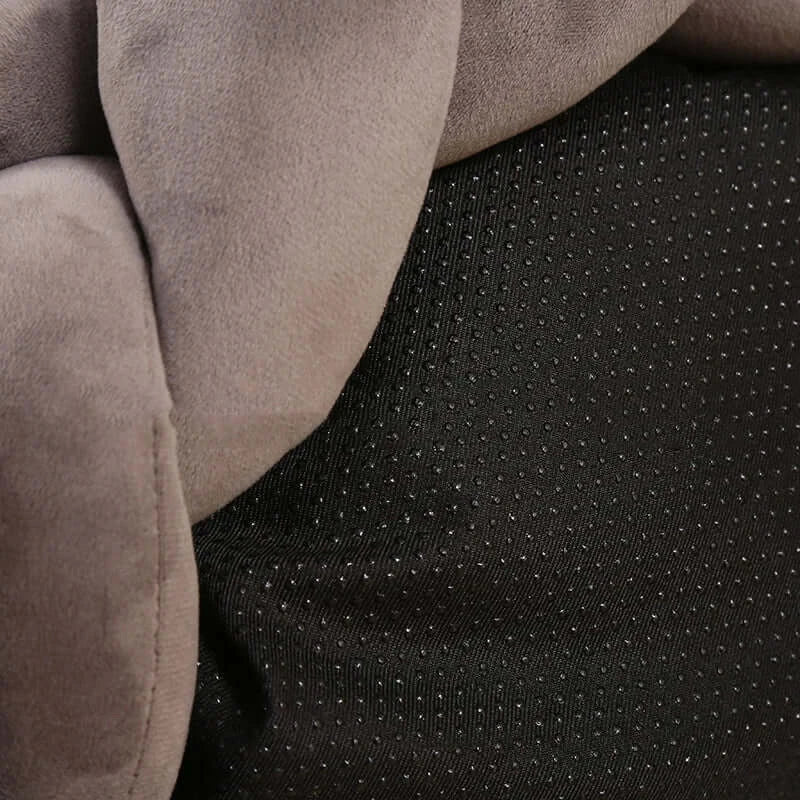 Close-up of a soft, handmade knit cat and dog bed showcasing plush gray fabric and durable black base for warmth and comfort.