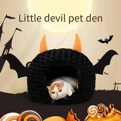 Halloween-themed pet house with bat wings and cat inside, cozy and festive design for pets.