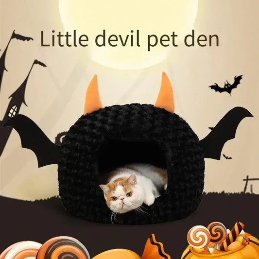 Halloween-themed pet house with bat wings and cat inside, cozy and festive design for pets.