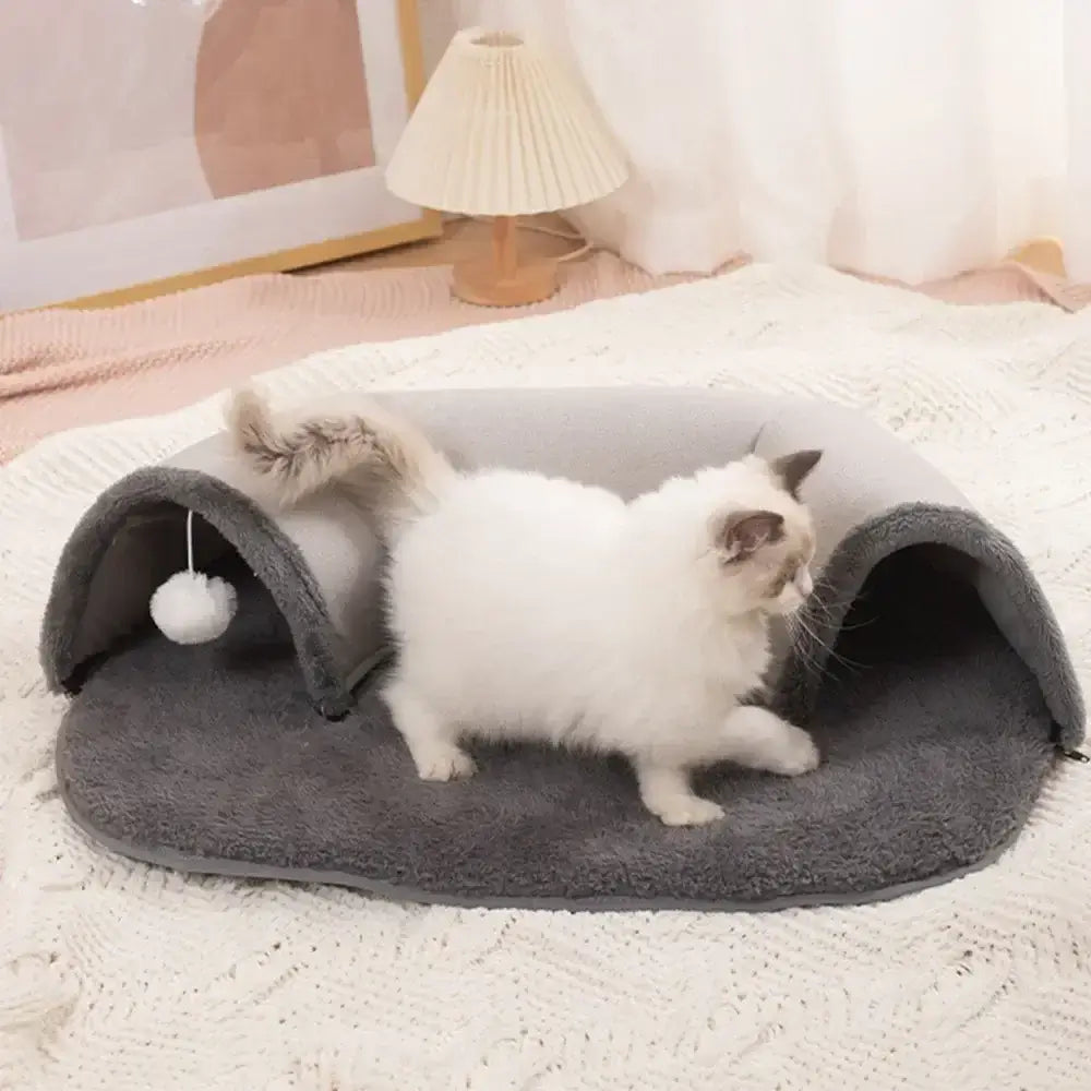 Discover the ultimate multifunctional cat toy! This interactive pet cat tunnel also serves as a bed, house, and training toy. Perfect for playful kittens.