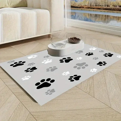 Splash-proof pet feeding mat with paw print design, non-slip surface, and diatom mud for spill absorption. Ideal for cats and dogs.