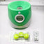 Automatic dog tennis ball launcher with accessories and tennis balls for outdoor pet play.