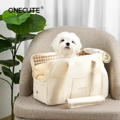 Small dog in Puppy Go Out Portable Dog Carrier Bag, cushioned interior, on beige chair, with plant nearby, ideal for travel and comfort.